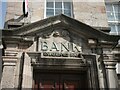 Above the entrance door of the HSBC bank on the High Street, Bangor