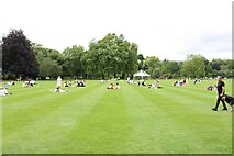 TQ2879 : View of people picnicking on the lawn of Buckingham Palace by Robert Lamb