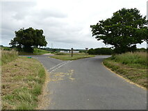 TG2134 : Junction of unnamed road with A140 by David Pashley