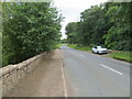 Road (A937) and bridge crossing a drain at South Hill of Craigo