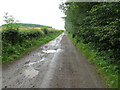 Minor road in need of repair near to Ecclesgreig