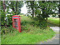 Old  telephone box beside the lane