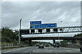 On the M25 clockwise approaching junction 19, bridge and power lines crossing the motorway