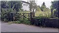 Gateway for track passing houses on SW side of Plains Road