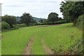 Sloping grass field below A40, Llannon Road