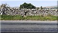SD9189 : Dry stone wall on north side of A684 on east side of road to Far Borwins by Roger Templeman