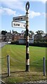 Cumberland County Council finger signpost at road fork on NW side of Cumwhinton