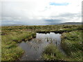 NT1058 : Boggy pool on West Cairn Hill by Alan O'Dowd