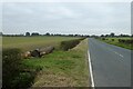 SE4776 : Old and new logs beside the road by DS Pugh