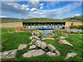 Lake and outdoor seating at Gloucester Services