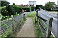 Path down embankment beside Northiam Road (A28) looking towards Broad Oak Crossroads