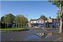 SO9097 : Shops and roundabout near Penn Fields in Wolverhampton by Roger  D Kidd