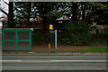 A bus shelter, a speed camera and a housing development on the B3233