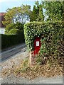 Battered post box on Barn Lane