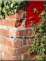 Battered post box on Barn Lane