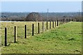 Fence across green fields above Horton Common