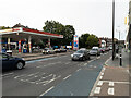 TQ2670 : View north-east along High Street Colliers Wood including petrol station by Tom Page