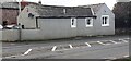 NY4252 : Pebbledashed building on SW side of A6 at Carleton Farm Mews by Roger Templeman