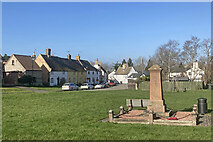 TL5666 : Reach; cottages and war memorial, Fair Green by John Sutton