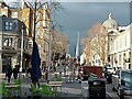 Sunshine contrasts with dark clouds, Exhibition Road, South Kensington