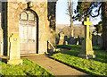 NY5455 : Gravestones and war memorials at St. Peter's Church by Trevor Littlewood
