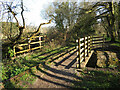 Footpath, bridge and disused railway line near Pontyates