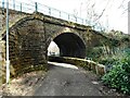 Old railway bridge over a path and the Pow Burn