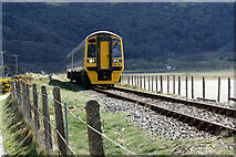 SH6214 : A train for Pwllheli approaching Barmouth Bridge by John Lucas