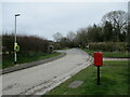 Junction  at  Octon,  letterbox, old  bus  shelter  and  defibrillator