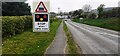 B6413 approaching level crossing beside Brampton Fell signal box