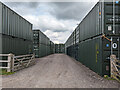 TQ3415 : Containers, Hayleigh Farm by Robin Webster