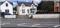 View of houses and milestone on NE side of Glasgow Road