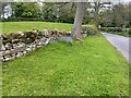 Dry stone wall and flowers on Warkworth high street