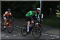 View of cyclists in the RideLondon event turning the corner from Broadmead Road into High Road Woodford Green #3