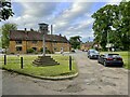 The heart of Chipping Warden with its village sign