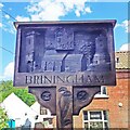 TG0334 : Briningham village sign - refurbished by Jane Rackham