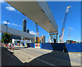 TQ2182 : View under conveyor bridge to cranes and towers by David Hawgood