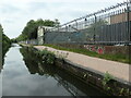 SP0988 : Security fencing along the Grand Union towpath by Christine Johnstone
