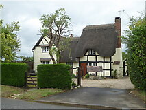 SO9747 : Thatched Cottage, Upper Moor by Chris Allen