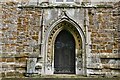 SP5153 : Byfield, Church of the Holy Cross: Decorated period west doorway with continuous ballflower moulding by Michael Garlick