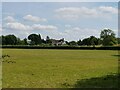 View across a paddock to a house in Cowsden