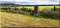 High Dyke triangulation pillar beside fence dividing arable fields