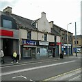 NS6573 : Businesses on Cowgate, Kirkintilloch by Richard Sutcliffe