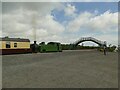 NU1912 : Loco and footbridge at Lionheart station by Stephen Craven