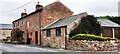 Mill House on SE side of road at Low Dyke