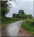 Wires over a wet road in rural Herefordshire