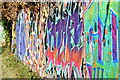 Colourful graffiti beside the towpath