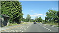 The A494 north at Llanfor village sign