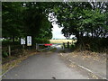 Gated track to Bramshot Farm