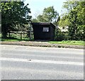 SO8313 : Wooden bus shelter, Stroud Road, Whaddon, Gloucestershire by Jaggery